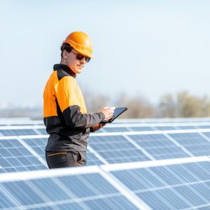 engineer-servicing-solar-panel-on-electric-plant.jpg